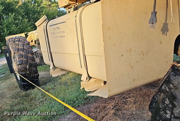 image for item DQ0334 1999 Stewart & Stevenson M 1079  truck cab and chassis