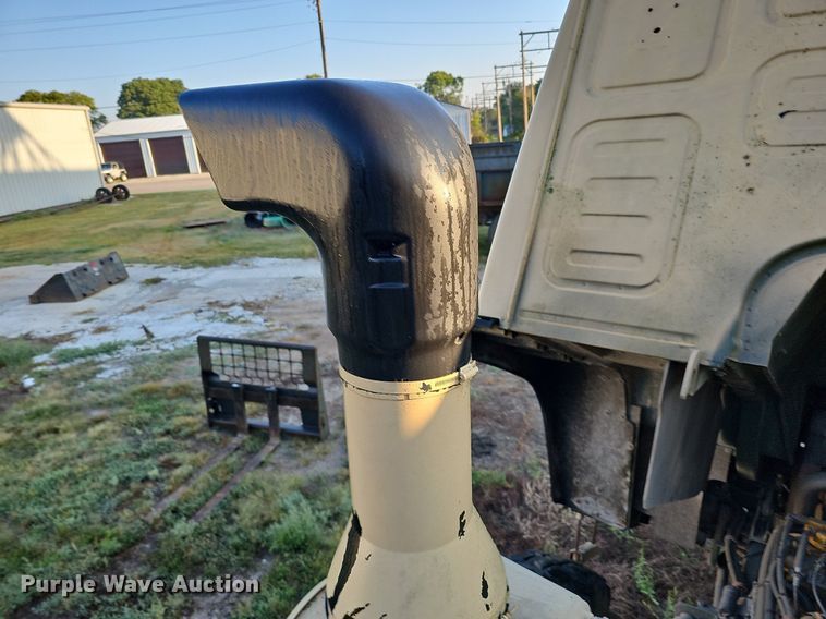 image for item DQ0334 1999 Stewart & Stevenson M 1079  truck cab and chassis