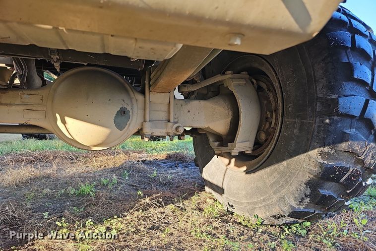 image for item DQ0334 1999 Stewart & Stevenson M 1079  truck cab and chassis