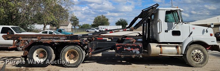 image for item DP2480 1999 Volvo WG64  roll-off container truck