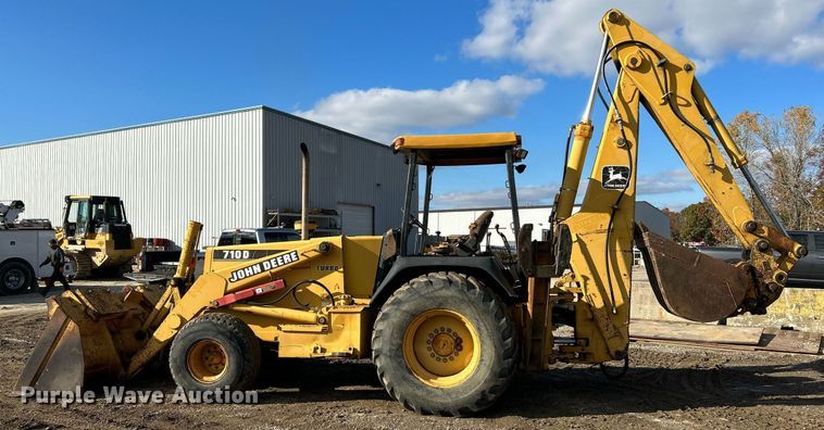 image for item NR9317 1997 John Deere 710D  backhoe