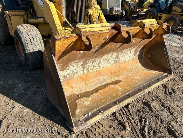 image for item NR9317 1997 John Deere 710D  backhoe