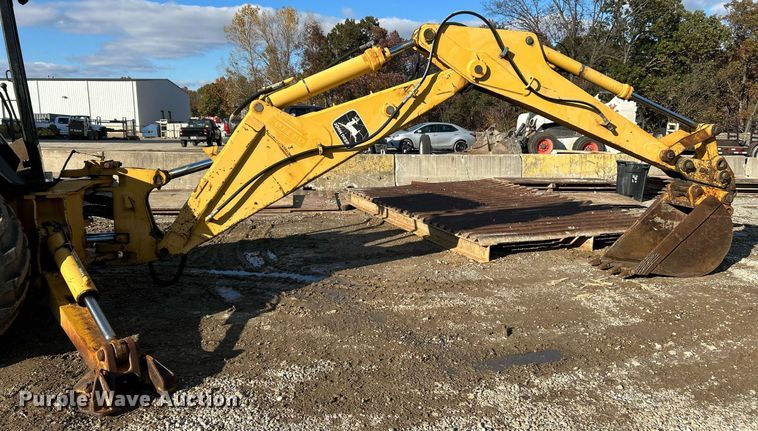 image for item NR9317 1997 John Deere 710D  backhoe