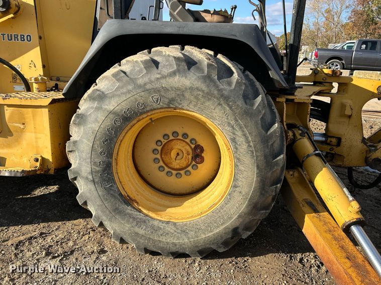 image for item NR9317 1997 John Deere 710D  backhoe