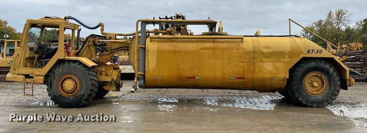 image for item JE9456 1997 Caterpillar 613C  water wagon