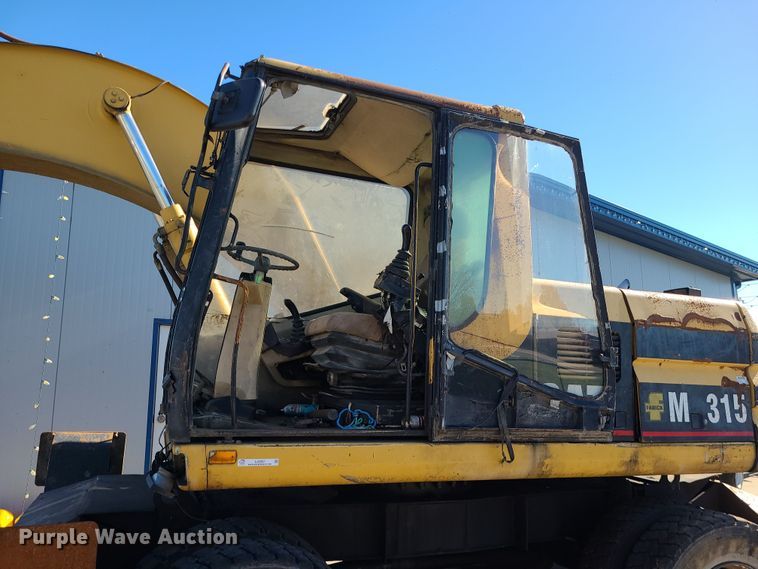 image for item LJ9357 2002 Caterpillar M315  wheeled excavator