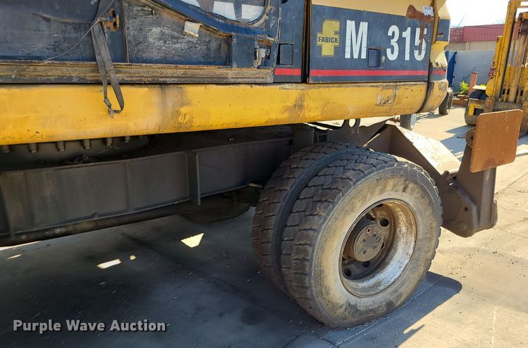 image for item LJ9357 2002 Caterpillar M315  wheeled excavator