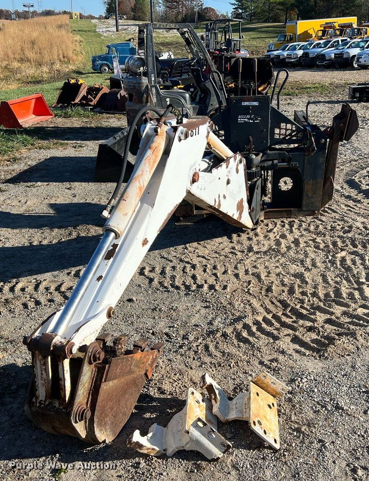 image for item NM9014 Melroe 811  skid steer backhoe