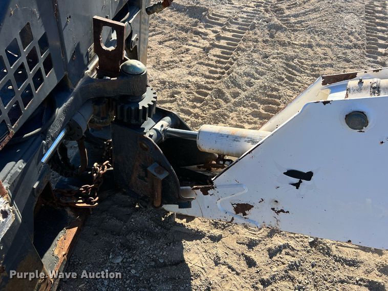 image for item NM9014 Melroe 811  skid steer backhoe