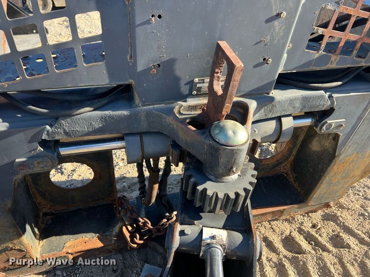 image for item NM9014 Melroe 811  skid steer backhoe