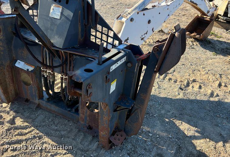 image for item NM9014 Melroe 811  skid steer backhoe