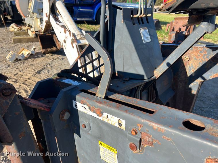 image for item NM9014 Melroe 811  skid steer backhoe