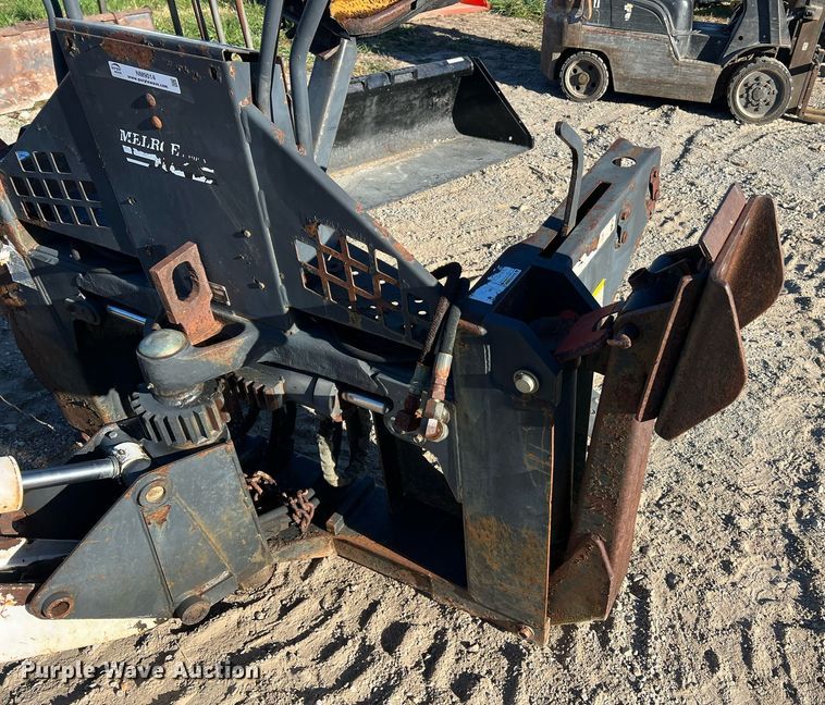 image for item NM9014 Melroe 811  skid steer backhoe