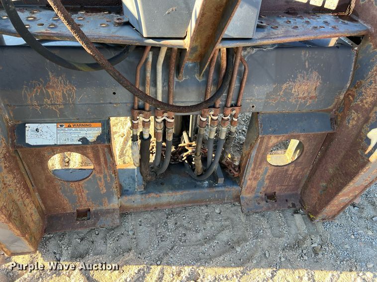 image for item NM9014 Melroe 811  skid steer backhoe