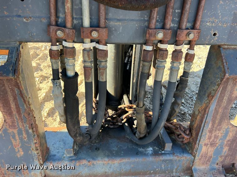 image for item NM9014 Melroe 811  skid steer backhoe