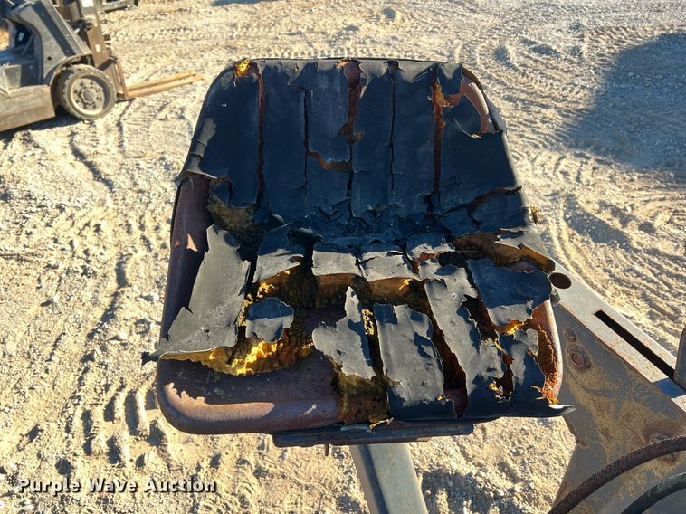 image for item NM9014 Melroe 811  skid steer backhoe