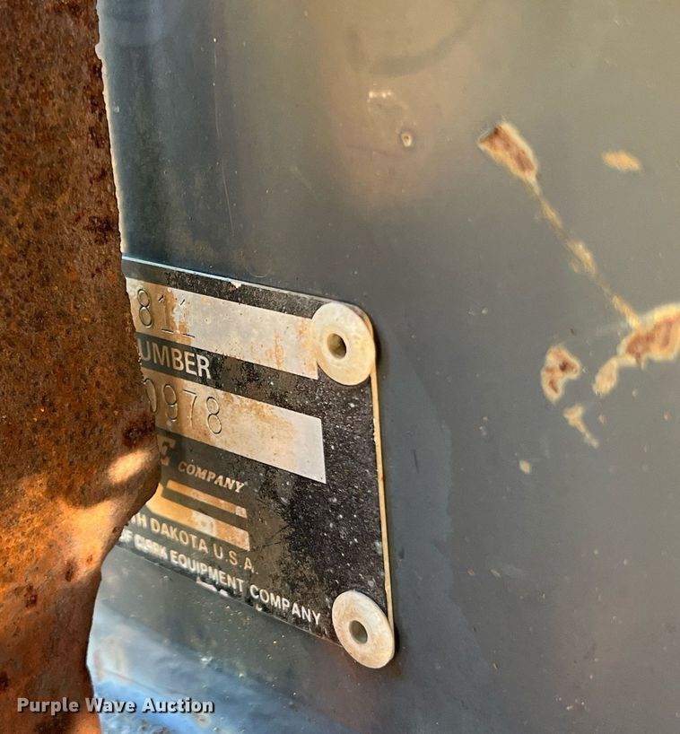 image for item NM9014 Melroe 811  skid steer backhoe