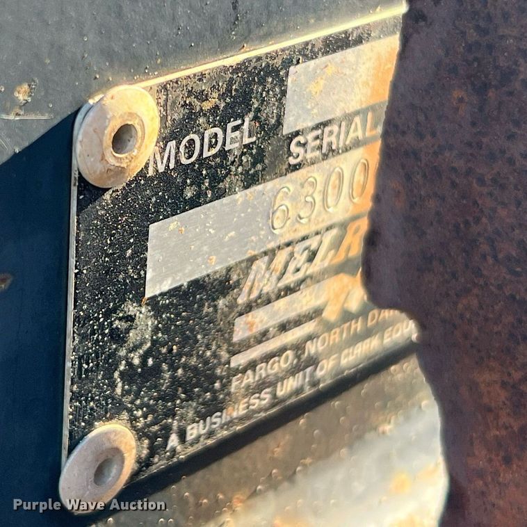 image for item NM9014 Melroe 811  skid steer backhoe