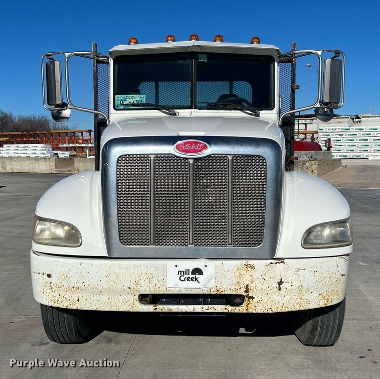 image for item DN0607 2014 Peterbilt 330  dump flatbed truck