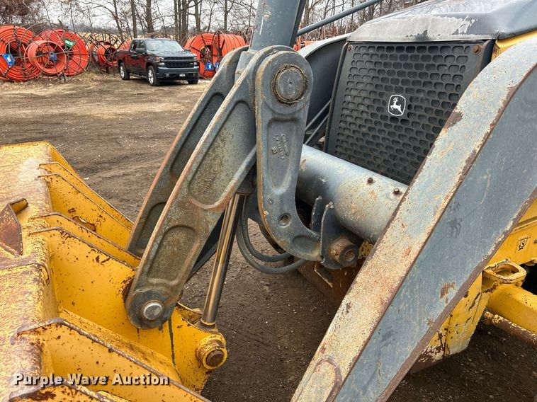 image for item DQ1068 2009 John Deere 710J  backhoe