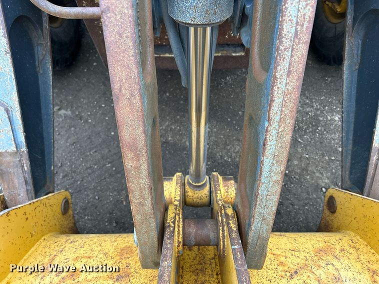 image for item DQ1068 2009 John Deere 710J  backhoe