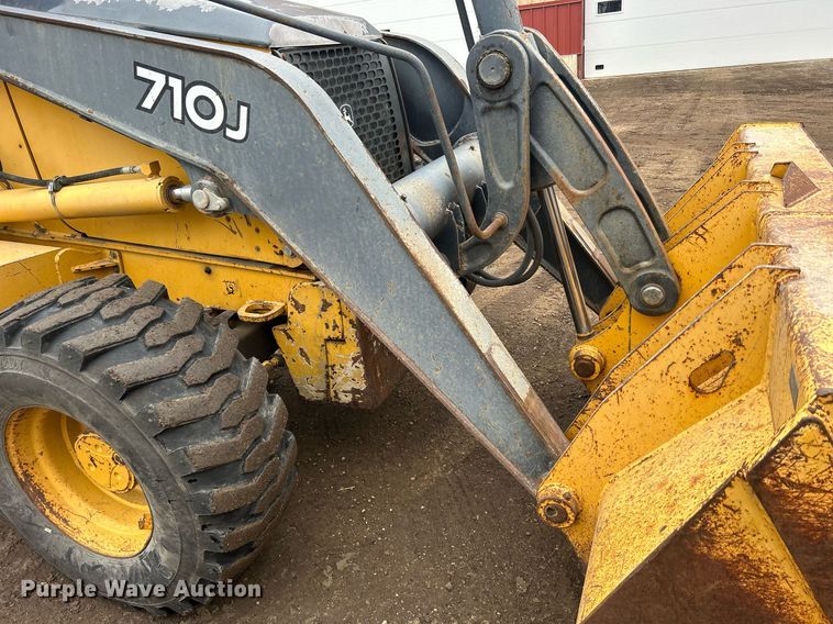 image for item DQ1068 2009 John Deere 710J  backhoe