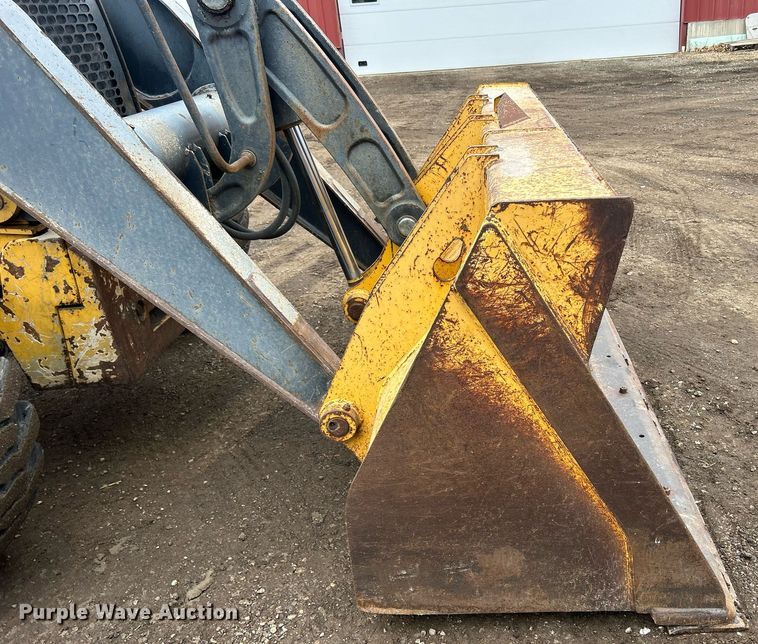 image for item DQ1068 2009 John Deere 710J  backhoe