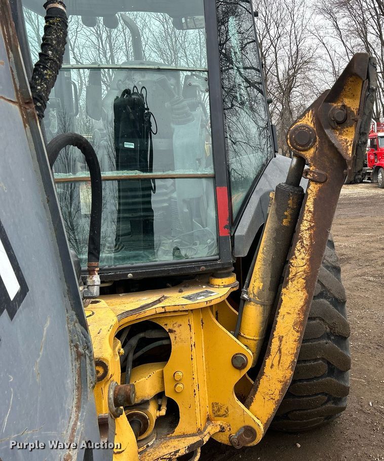 image for item DQ1068 2009 John Deere 710J  backhoe