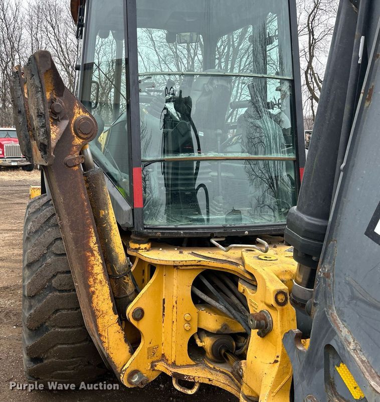 image for item DQ1068 2009 John Deere 710J  backhoe