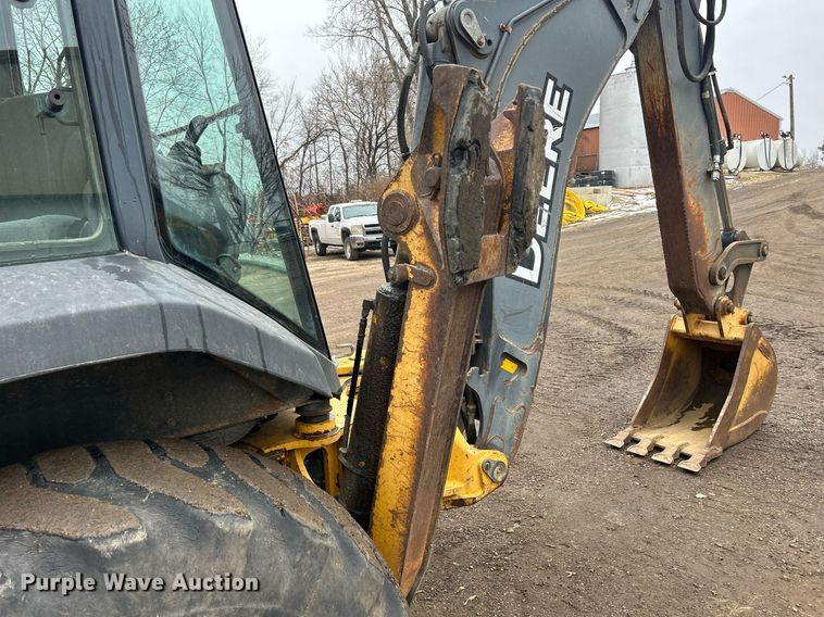 image for item DQ1068 2009 John Deere 710J  backhoe