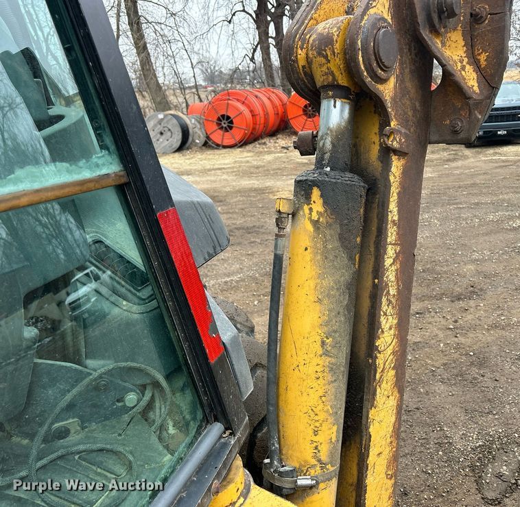 image for item DQ1068 2009 John Deere 710J  backhoe