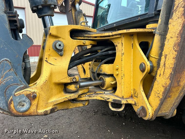 image for item DQ1068 2009 John Deere 710J  backhoe