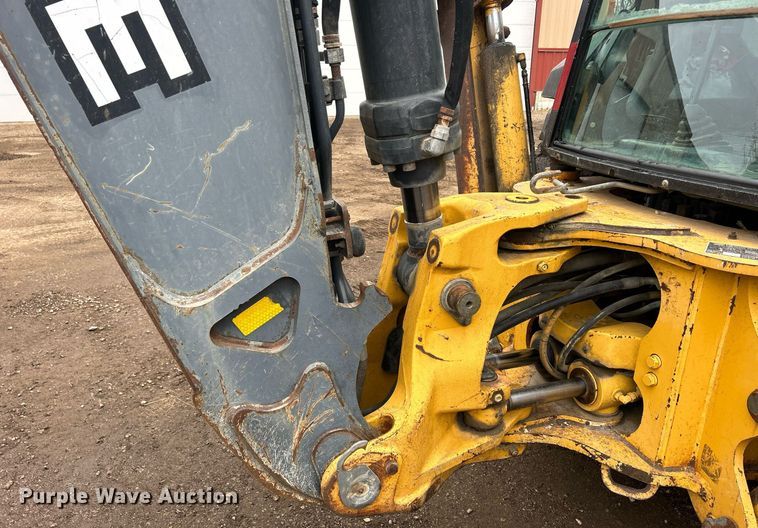 image for item DQ1068 2009 John Deere 710J  backhoe