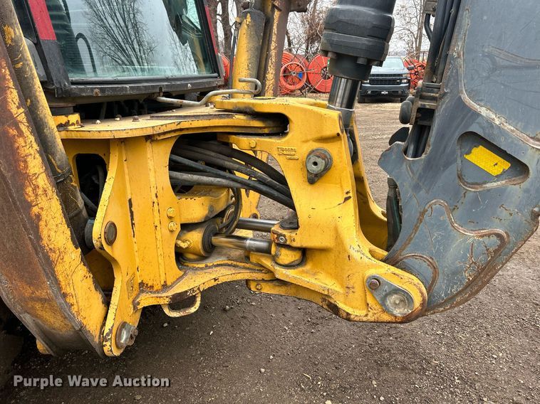 image for item DQ1068 2009 John Deere 710J  backhoe