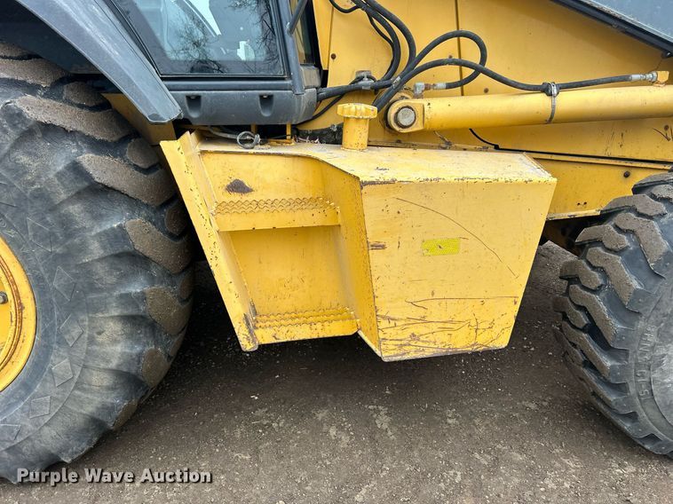 image for item DQ1068 2009 John Deere 710J  backhoe