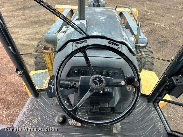 image for item DQ1068 2009 John Deere 710J  backhoe