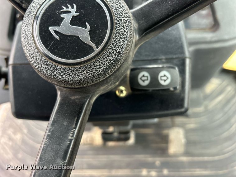 image for item DQ1068 2009 John Deere 710J  backhoe