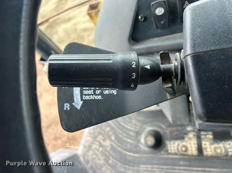 image for item DQ1068 2009 John Deere 710J  backhoe