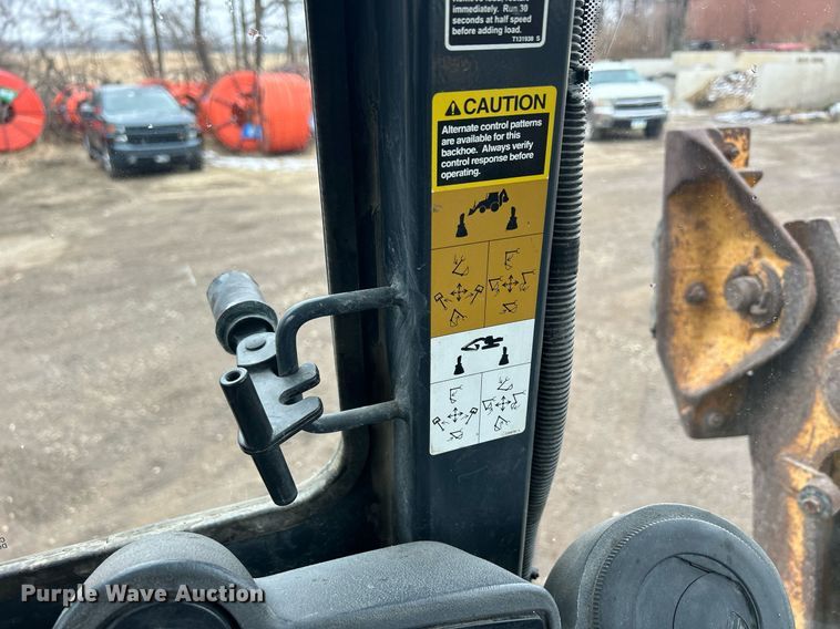 image for item DQ1068 2009 John Deere 710J  backhoe