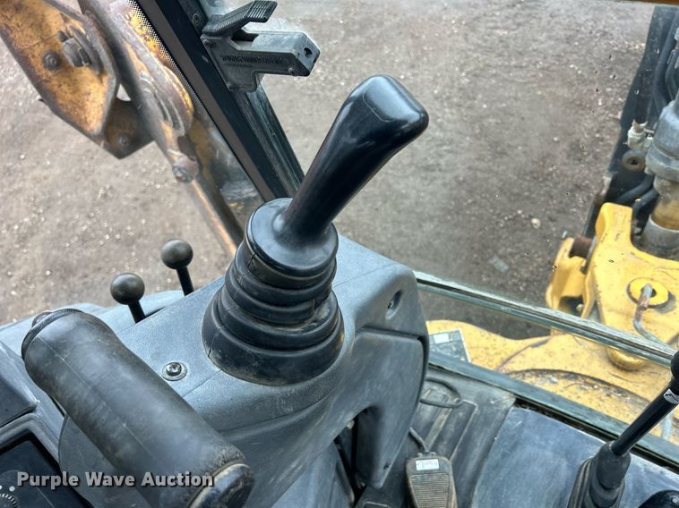 image for item DQ1068 2009 John Deere 710J  backhoe