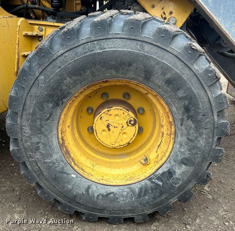 image for item DQ1068 2009 John Deere 710J  backhoe