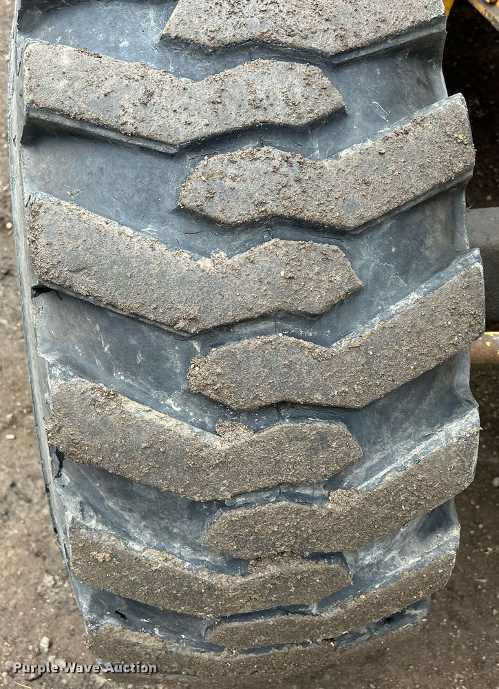 image for item DQ1068 2009 John Deere 710J  backhoe