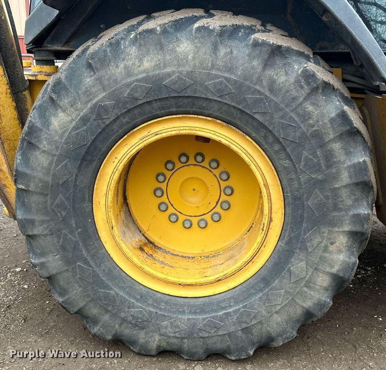 image for item DQ1068 2009 John Deere 710J  backhoe