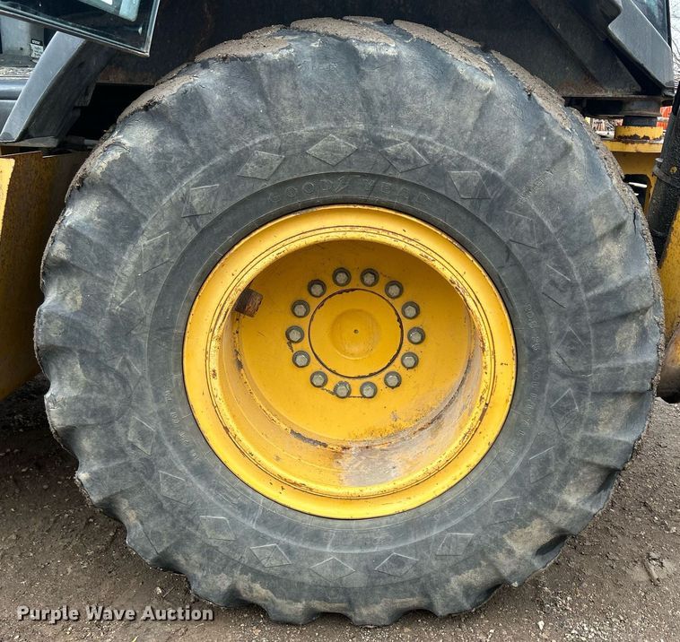 image for item DQ1068 2009 John Deere 710J  backhoe