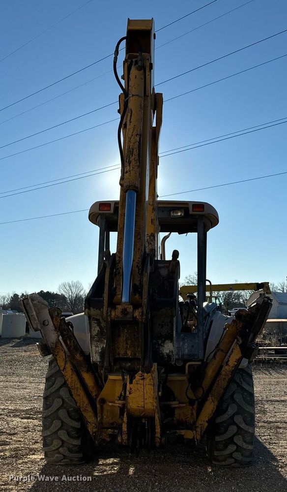 image for item NM9107 1999 New Holland 555E  backhoe