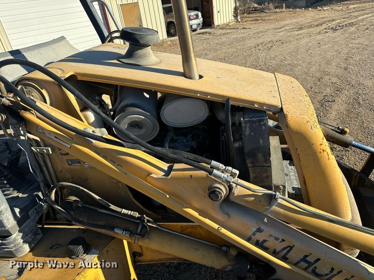 image for item NM9107 1999 New Holland 555E  backhoe