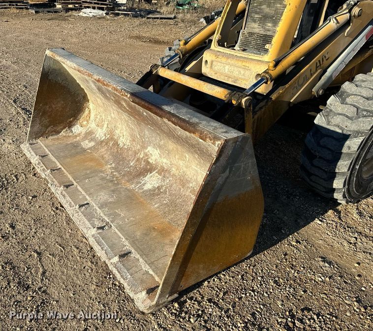 image for item NM9107 1999 New Holland 555E  backhoe