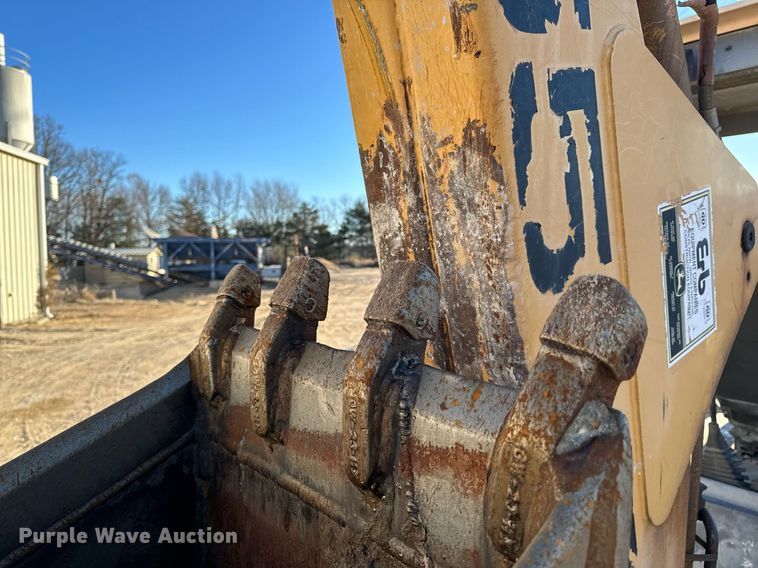 image for item NM9107 1999 New Holland 555E  backhoe