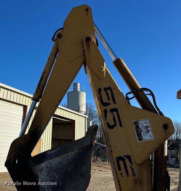 image for item NM9107 1999 New Holland 555E  backhoe