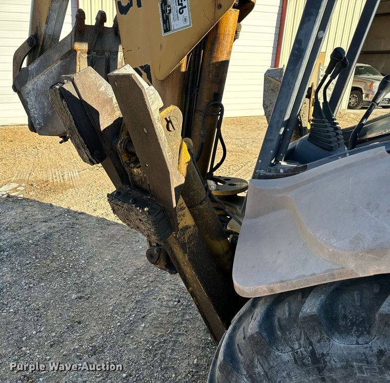 image for item NM9107 1999 New Holland 555E  backhoe